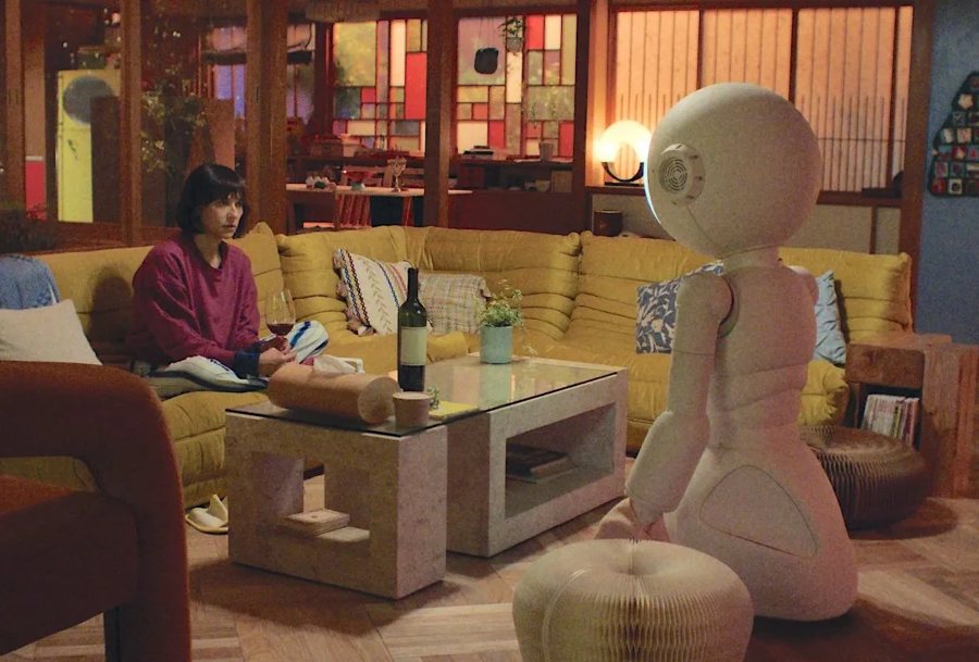 A still from the series Sunny: Rashida Jones beside a domestic robot